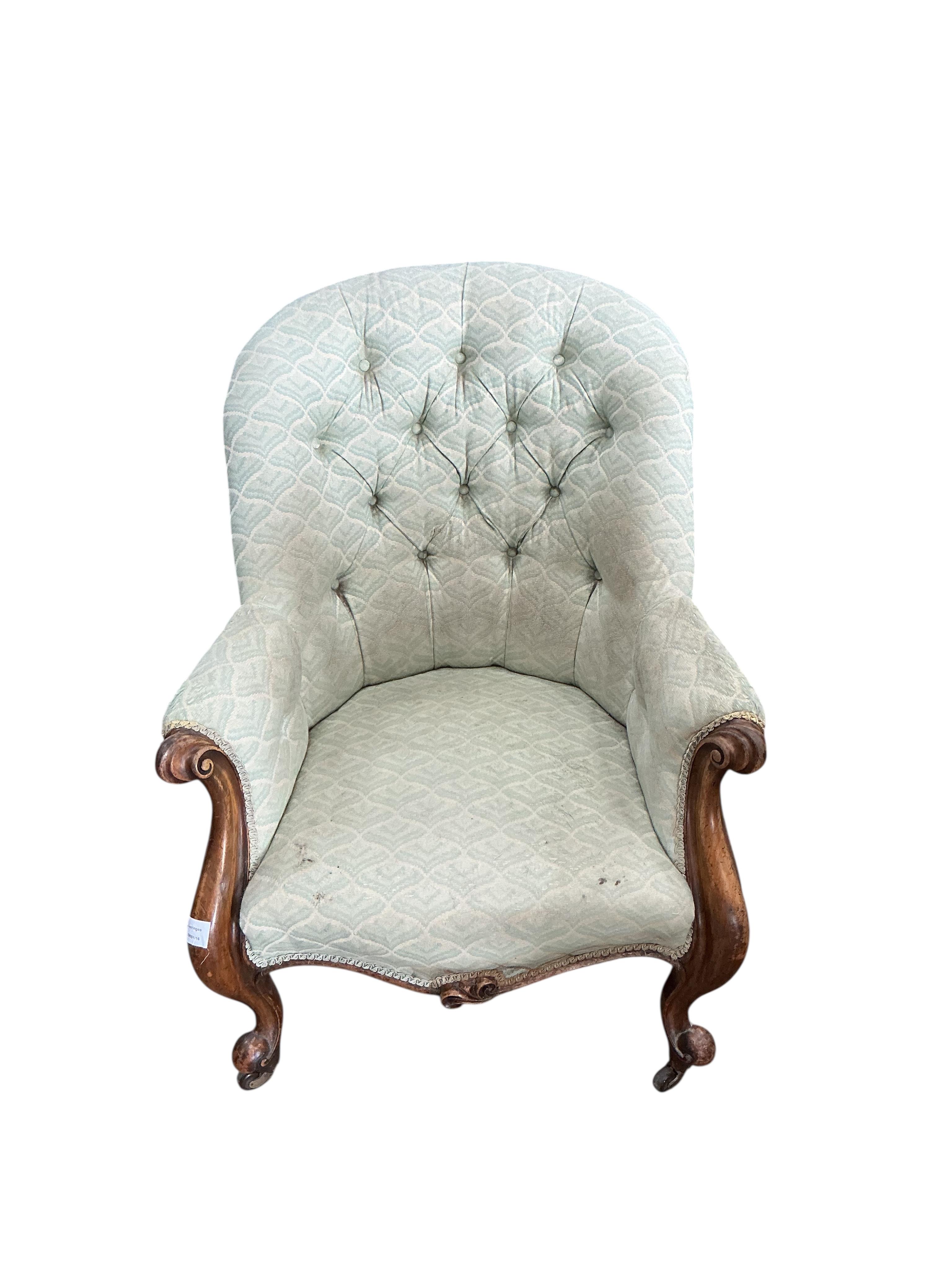A Victorian mahogany upholstered spoon back armchair, width 72cm, depth 86cm, height 91cm